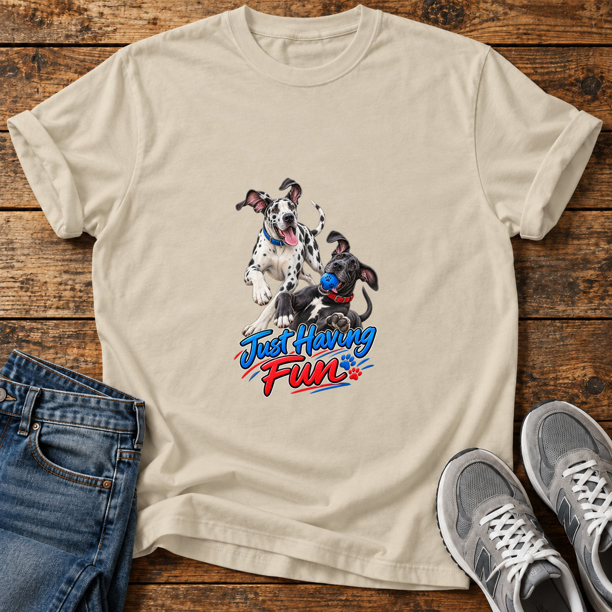Just Having Fun Great Dane graphic T-shirt in Sand, shown on a flat-lay shirt mockup