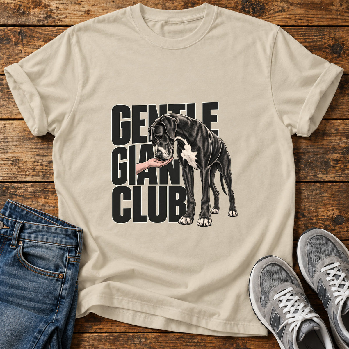 Gentle Giant Club Great Dane graphic T-shirt in Sand, shown on a flat-lay shirt mockup