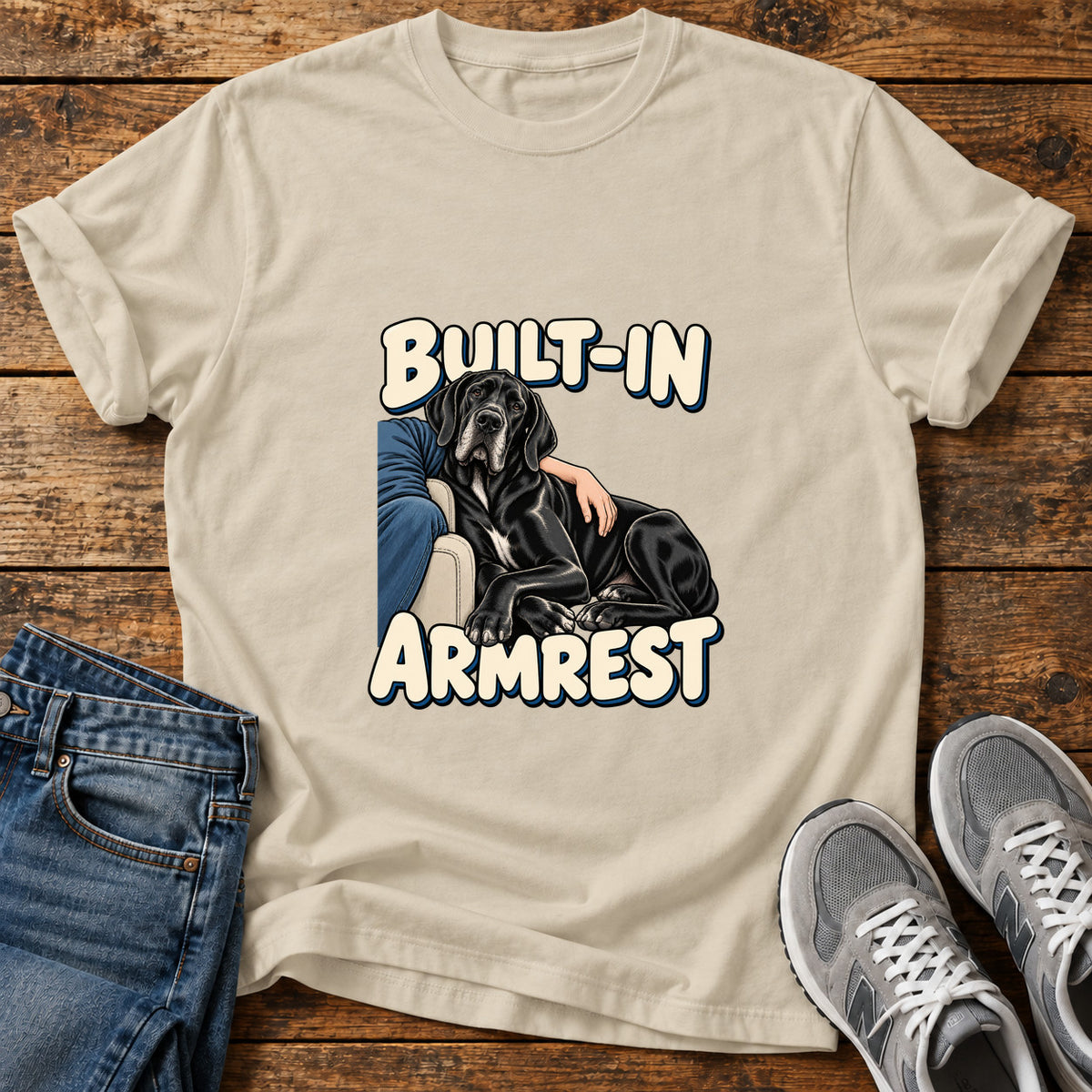 Built-In Armrest Great Dane graphic T-shirt in Sand, shown on a flat-lay shirt mockup