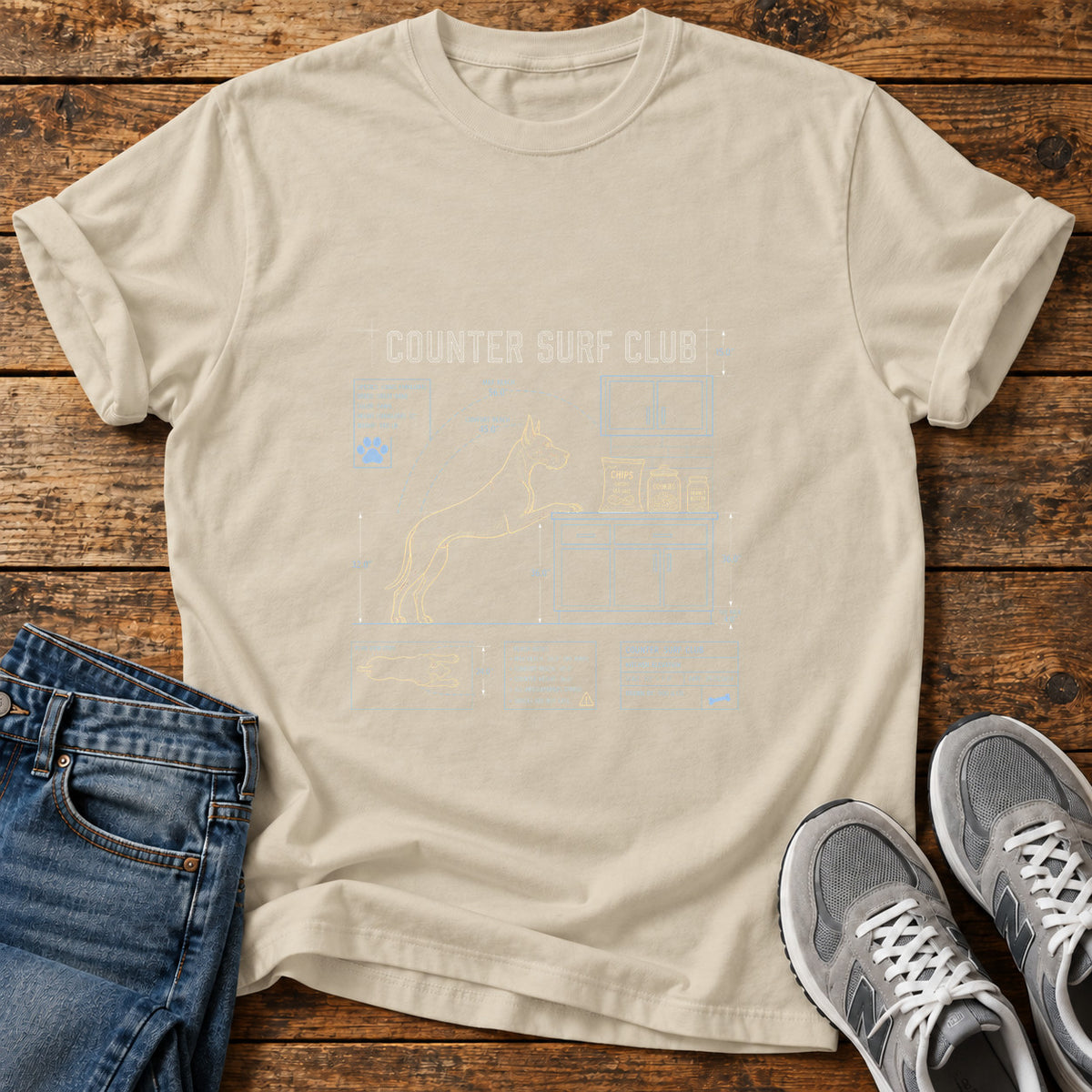 Counter Surf Club Great Dane graphic T-shirt in Sand, shown on a flat-lay shirt mockup