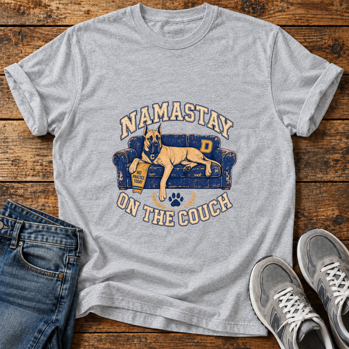 Namastay Couch Great Dane graphic T-shirt in Sport Grey, shown on a flat-lay shirt mockup