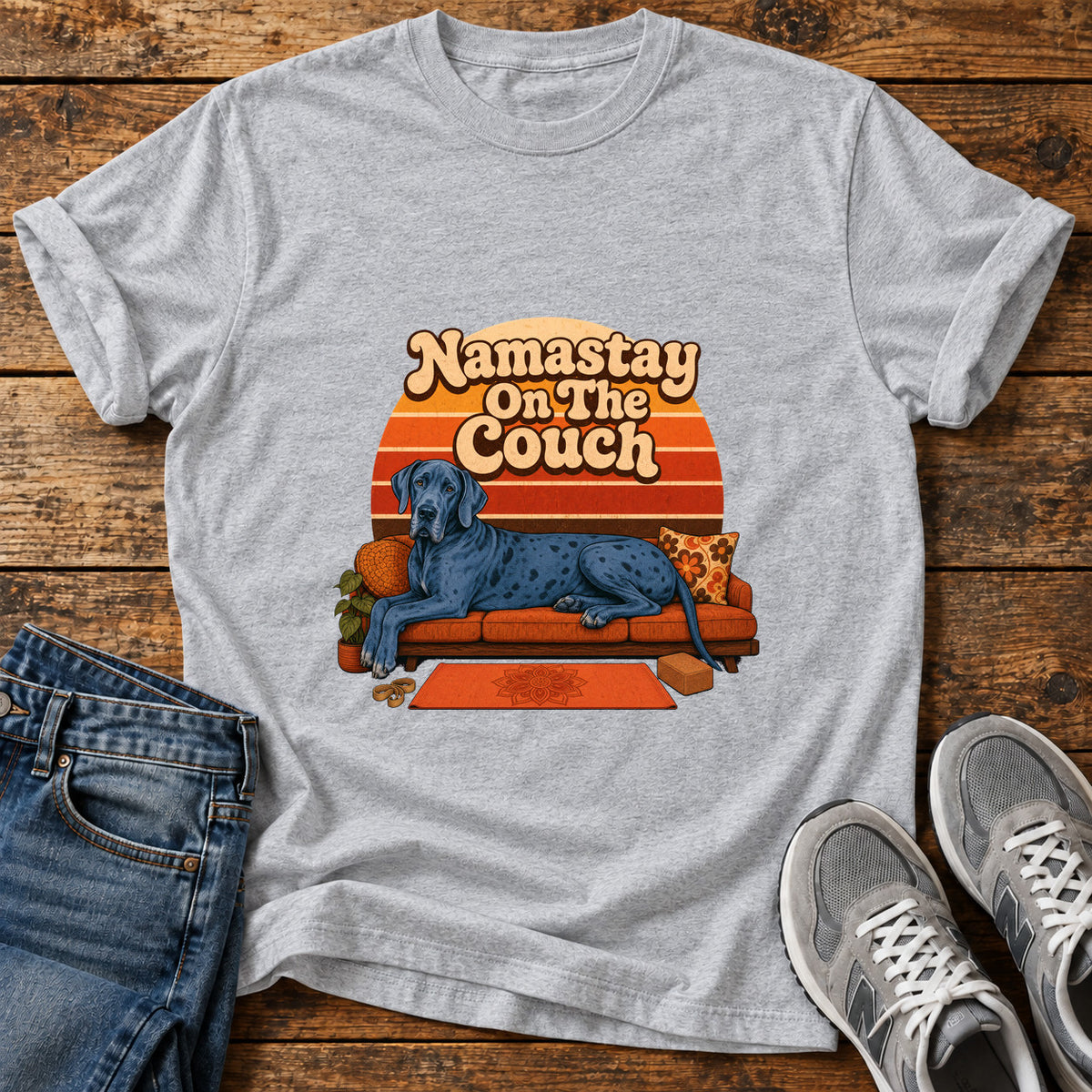 Namastay Couch Pooch Great Dane graphic T-shirt in Sport Grey, shown on a flat-lay shirt mockup