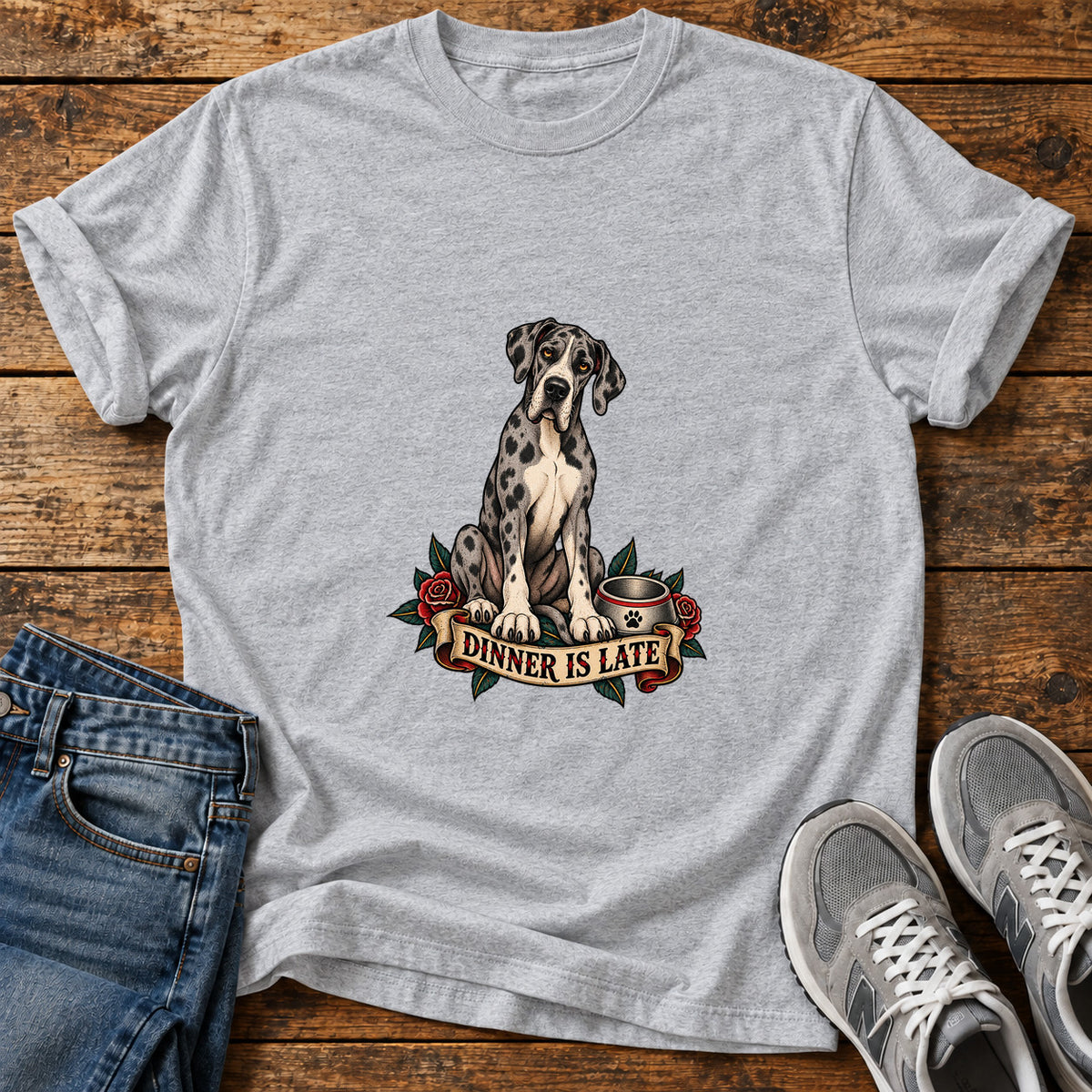 Dinner Is Late Great Dane graphic T-shirt in Sport Grey, shown on a flat-lay shirt mockup