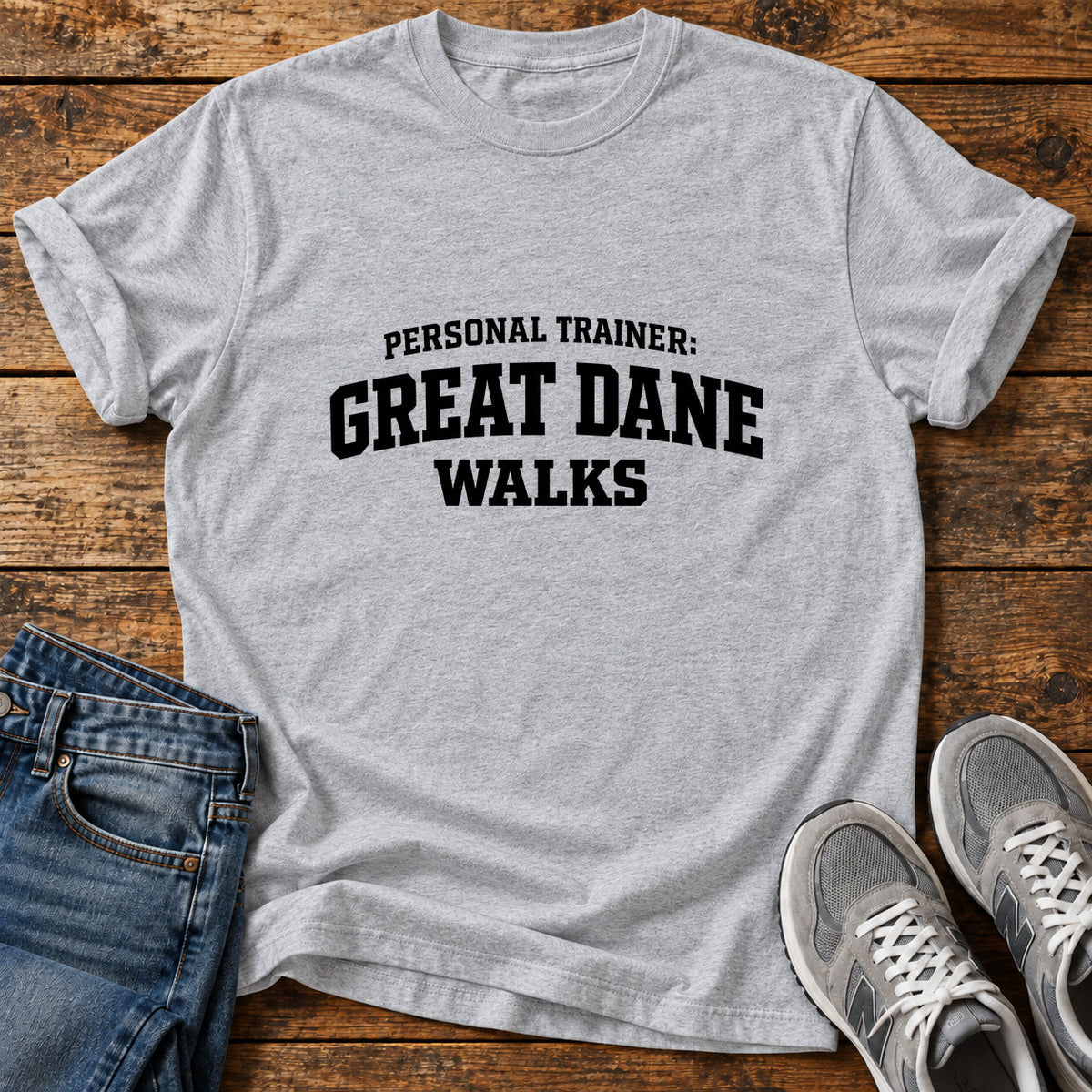Great Dane Trainer graphic T-shirt in Sport Grey, shown on a flat-lay shirt mockup