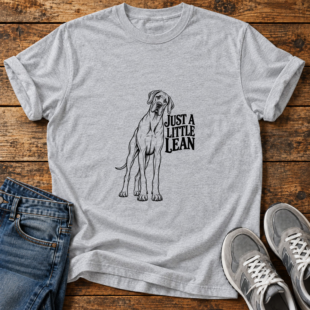 Just A Lean Great Dane graphic T-shirt in Sport Grey, shown on a flat-lay shirt mockup