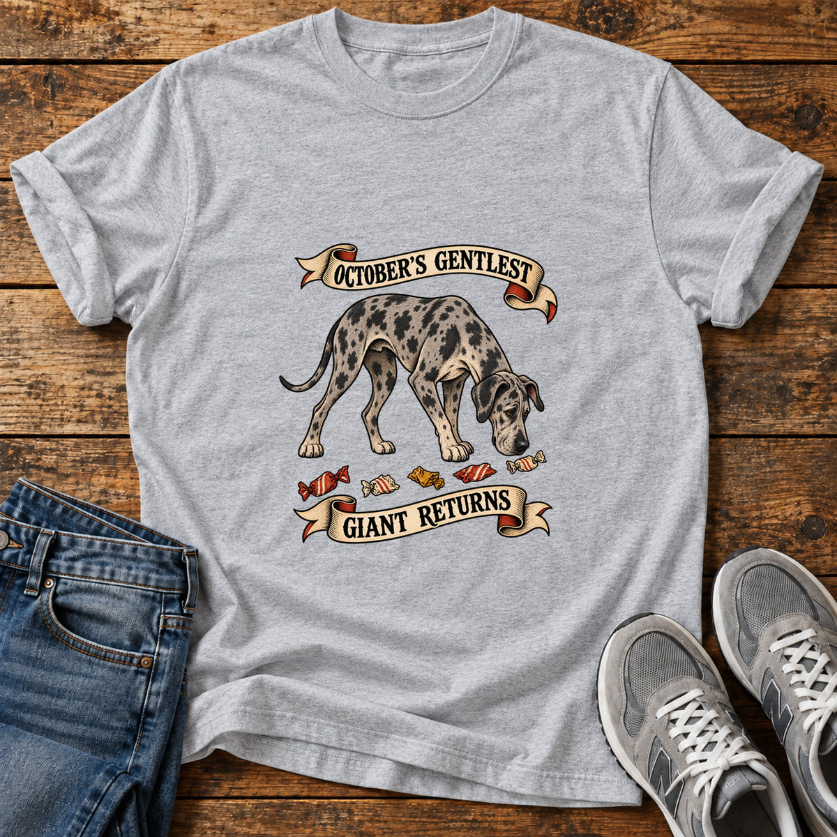 October's Gentlest Great Dane graphic T-shirt in Sport Grey, shown on a flat-lay shirt mockup