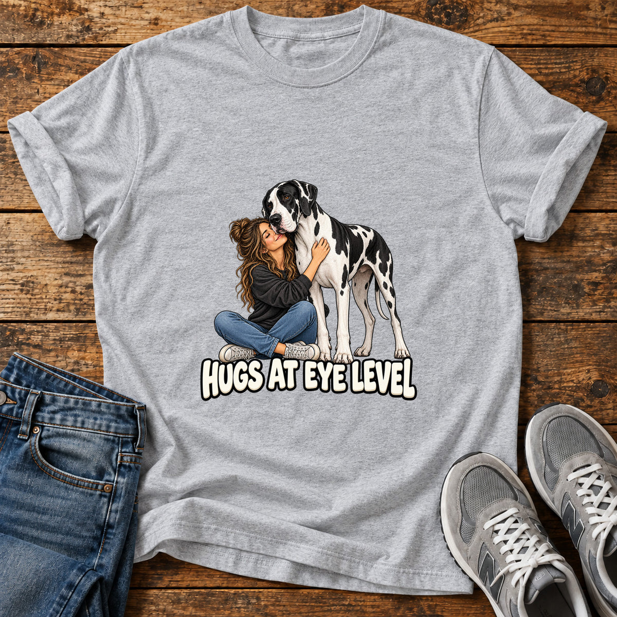 Hugs At Eye Great Dane graphic T-shirt in Sport Grey, shown on a flat-lay shirt mockup