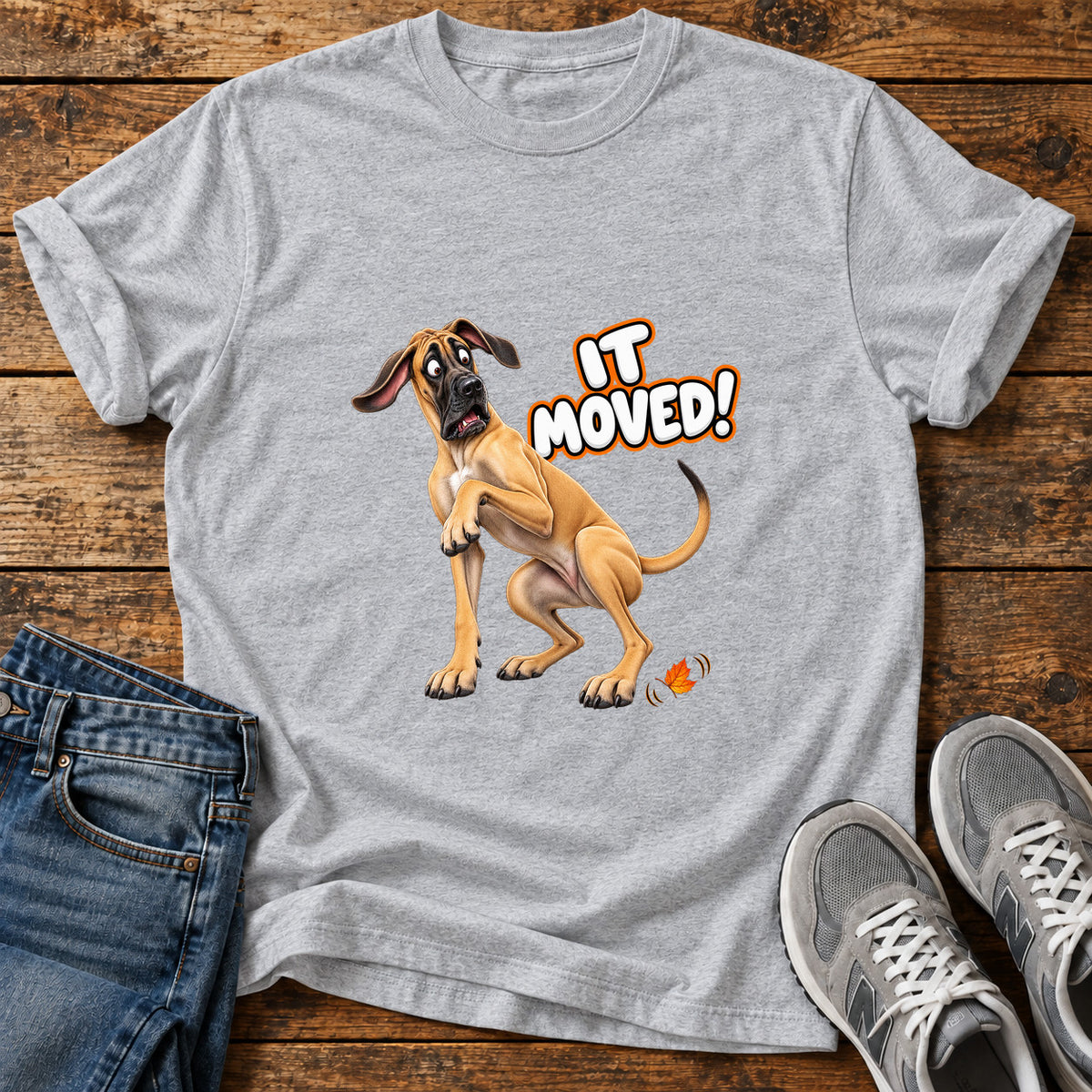 It Moved Great Dane graphic T-shirt in Sport Grey, shown on a flat-lay shirt mockup
