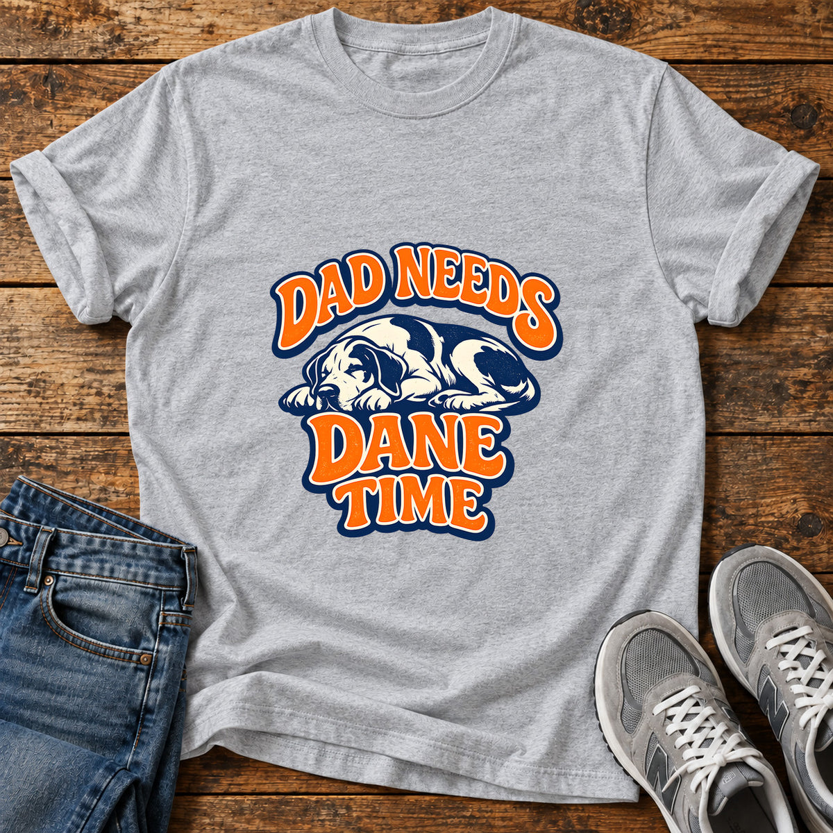 Dad Needs Dane Great Dane graphic T-shirt in Sport Grey, shown on a flat-lay shirt mockup