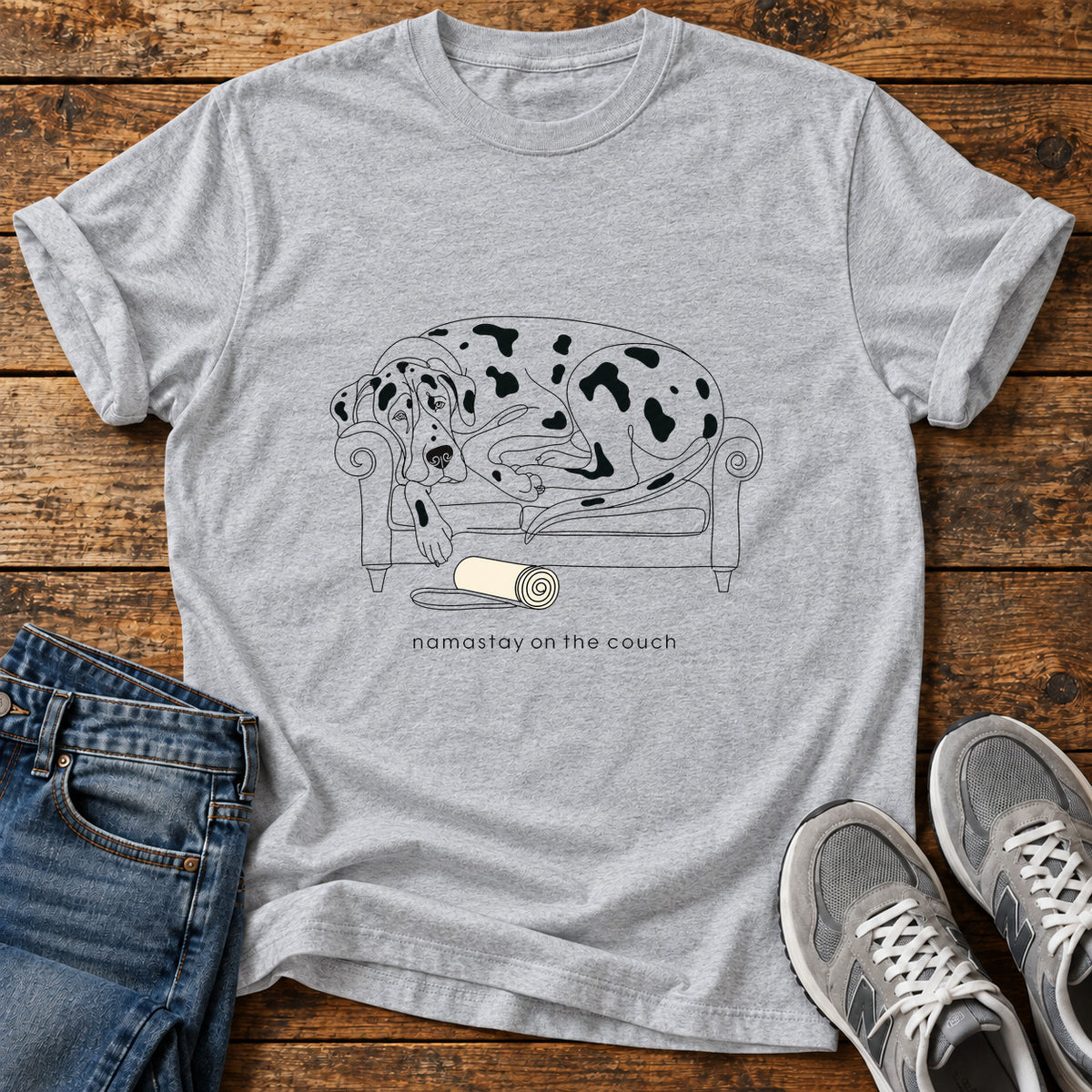 Namastay Couch Great Dane graphic T-shirt in Sport Grey, shown on a flat-lay shirt mockup