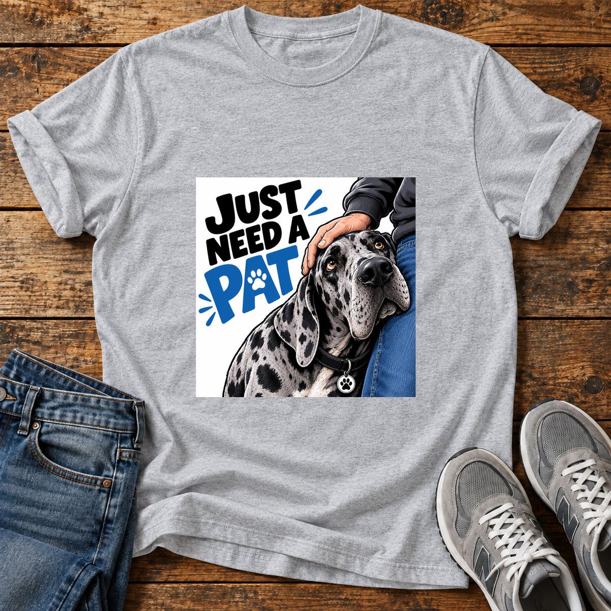 Just Need Pat Great Dane graphic T-shirt in Sport Grey, shown on a flat-lay shirt mockup
