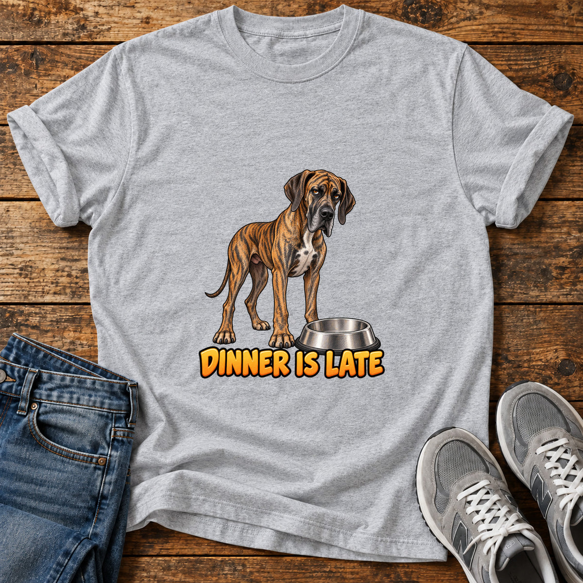 Dinner Is Late Great Dane graphic T-shirt in Sport Grey, shown on a flat-lay shirt mockup