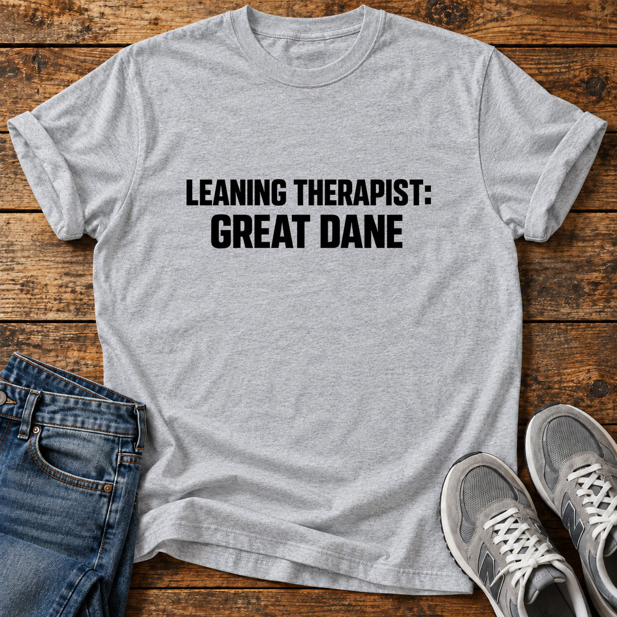 Leaning Therapist Great Dane graphic T-shirt in Sport Grey, shown on a flat-lay shirt mockup