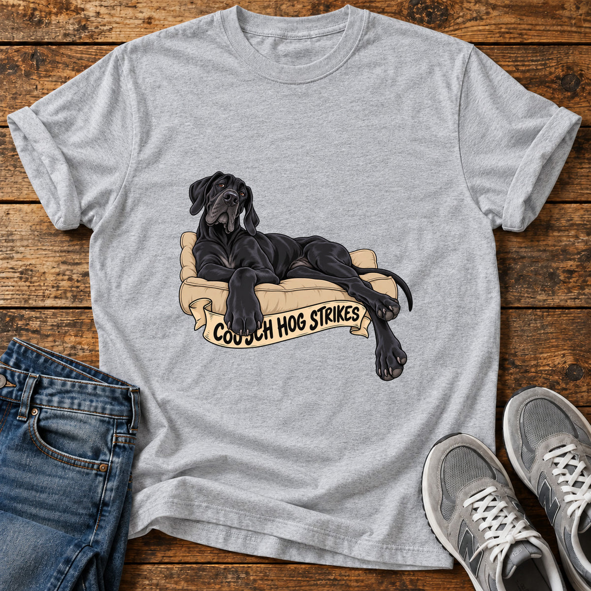 Couch Hog Strikes Great Dane graphic T-shirt in Sport Grey, shown on a flat-lay shirt mockup