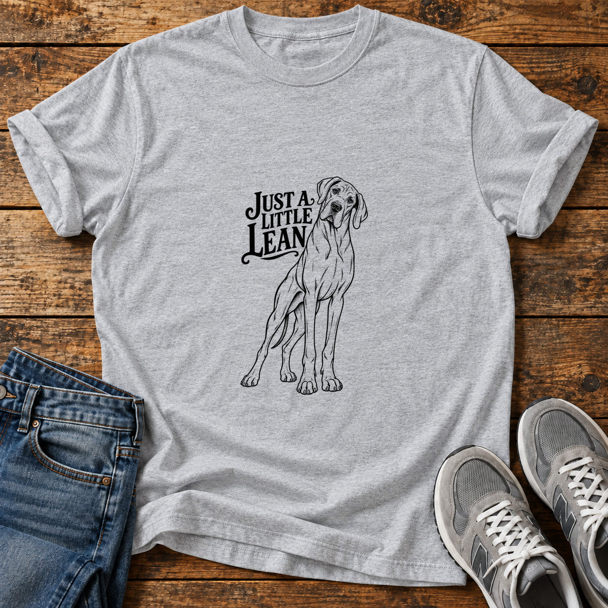 Just A Lean Great Dane graphic T-shirt in Sport Grey, shown on a flat-lay shirt mockup