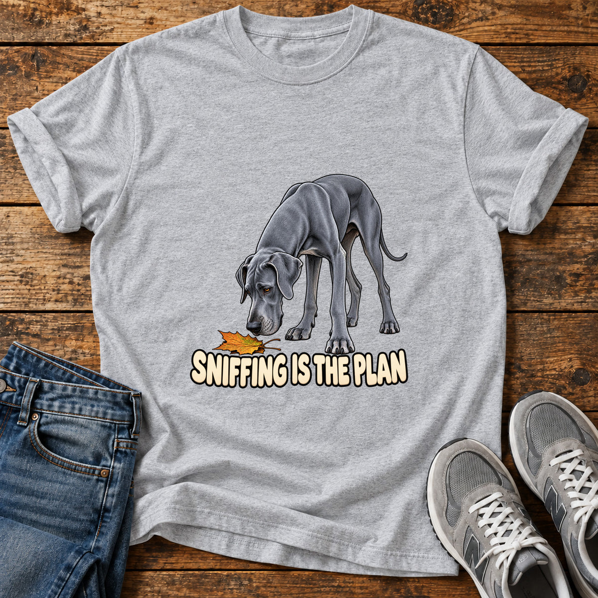 Sniffing Plan Great Dane graphic T-shirt in Sport Grey, shown on a flat-lay shirt mockup