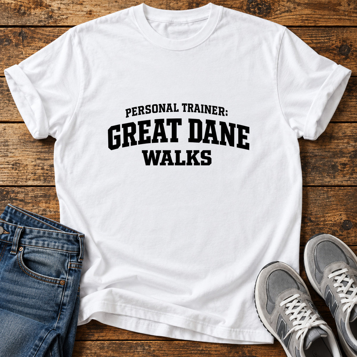 Great Dane Trainer graphic T-shirt in White, shown on a flat-lay shirt mockup