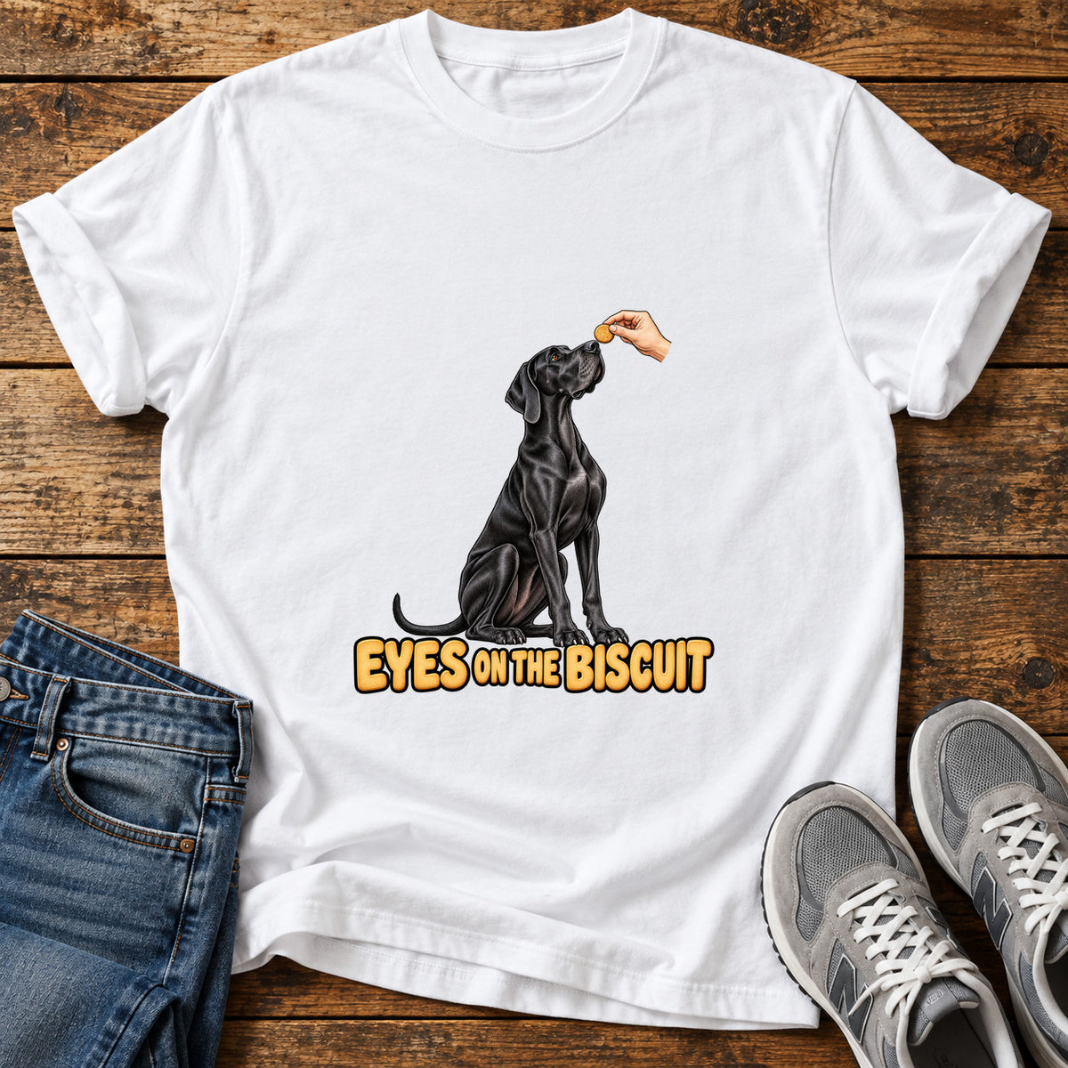 Eyes on Biscuit Great Dane graphic T-shirt in White, shown on a flat-lay shirt mockup