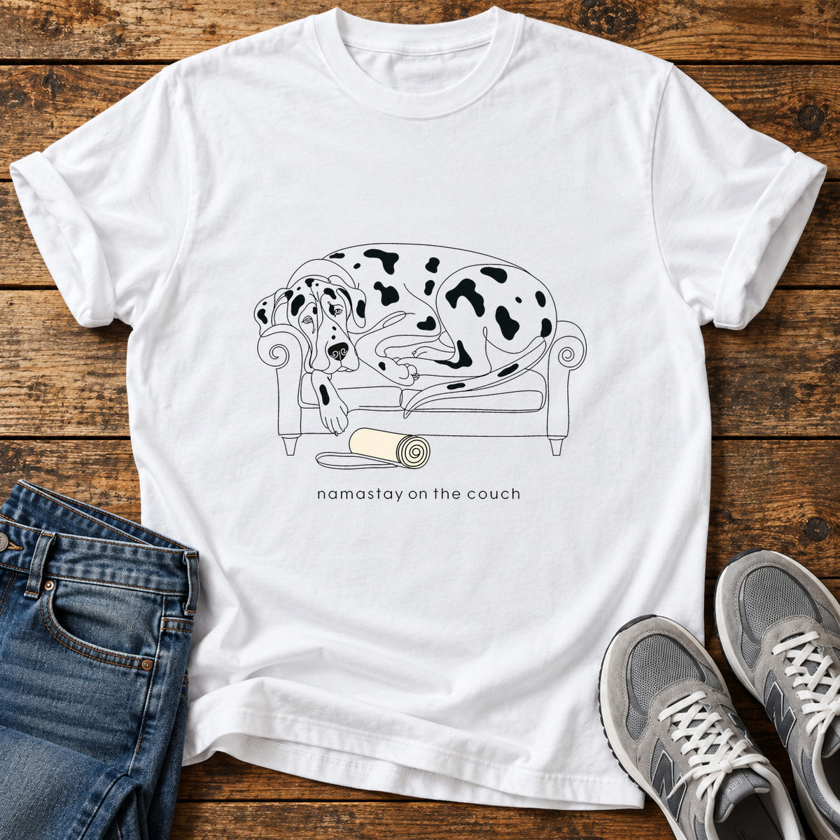 Namastay Couch Great Dane graphic T-shirt in White, shown on a flat-lay shirt mockup