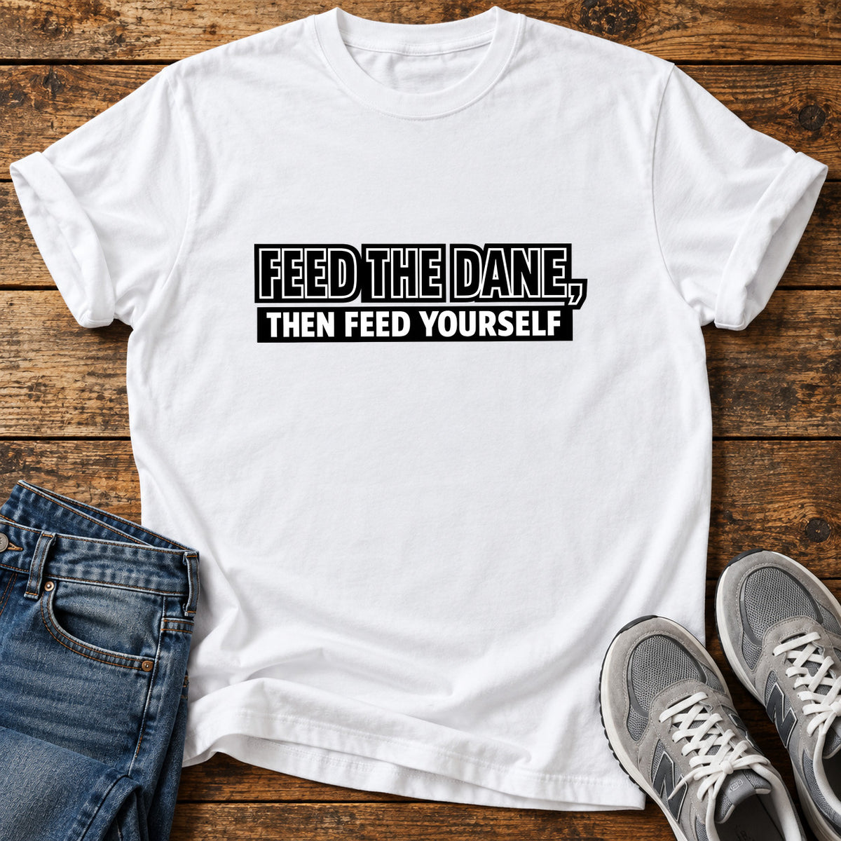 Feed The Dane Great Dane graphic T-shirt in White, shown on a flat-lay shirt mockup