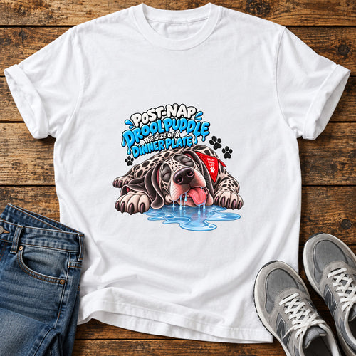 Drool Puddle Dog Great Dane graphic T-shirt in White, shown on a flat-lay shirt mockup