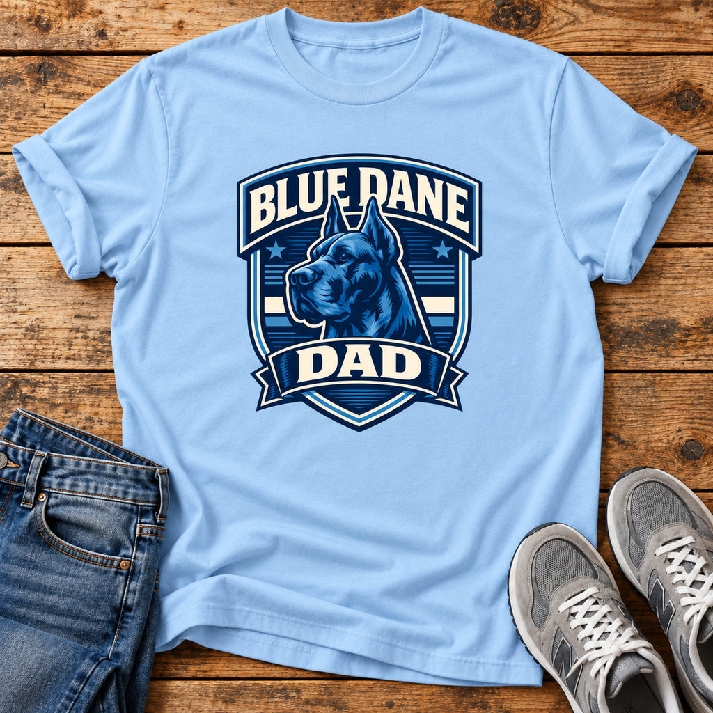 Blue Dane Dad T-shirt on a light wood flat lay with jeans and walking shoes