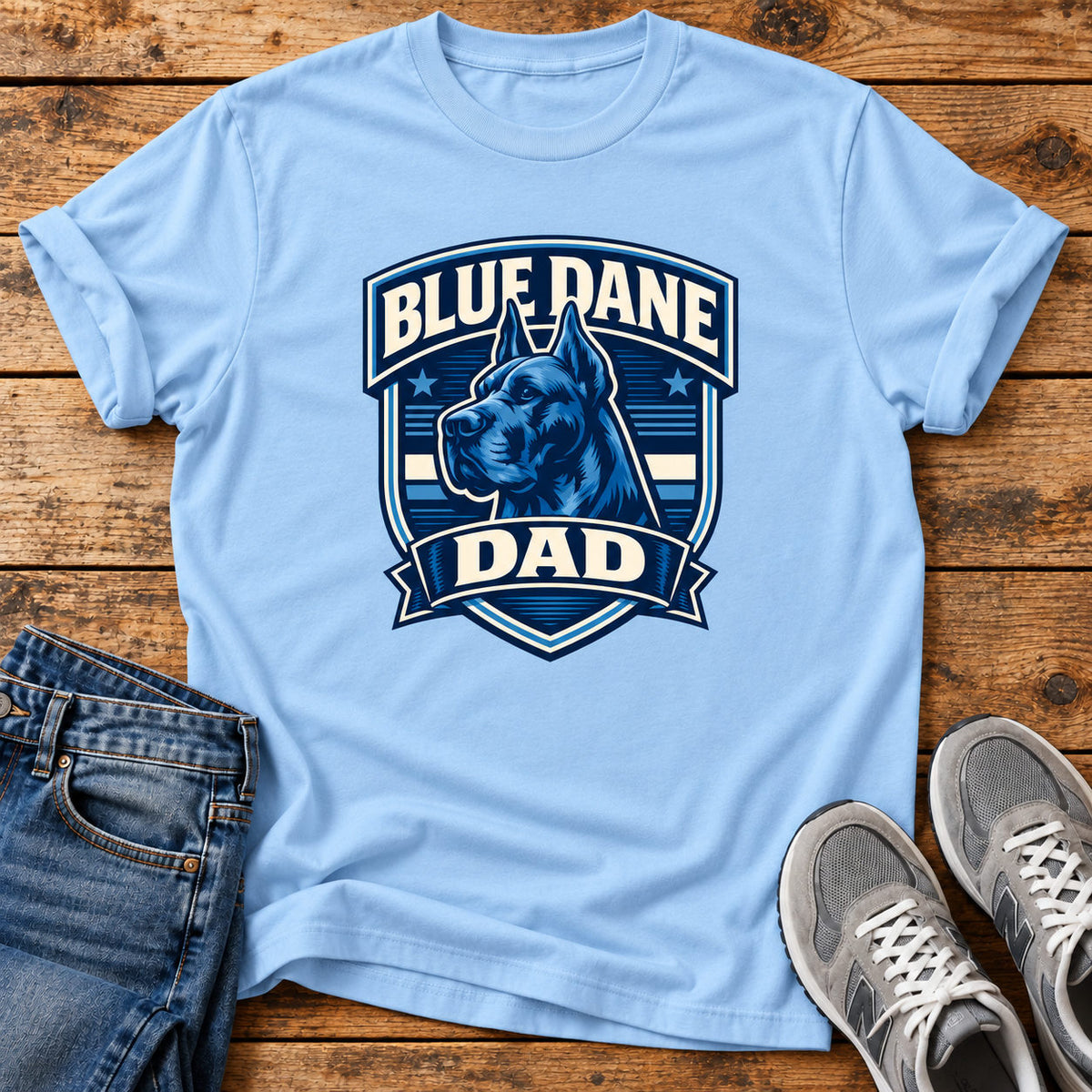 Blue Dane Dad T-shirt on a light wood flat lay with jeans and walking shoes